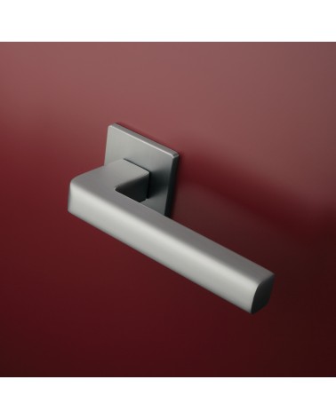 SALICE satin chrome door handle designer hardware mounted on a door