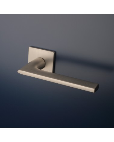 Brushed nickel SALVIA door handle designer handle fitted on a door