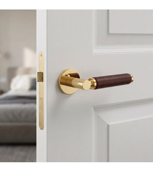 TUPAI 4200/201 round polished gold door handle with dark leather - designer handle