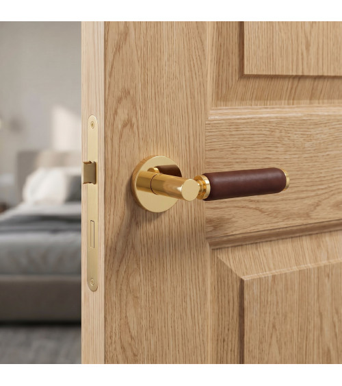 TUPAI 4200/201 round polished gold door handle with dark leather - designer handle