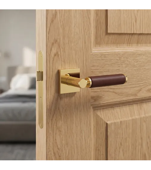 TUPAI 4200/201 square polished gold door handle with dark leather - designer handle