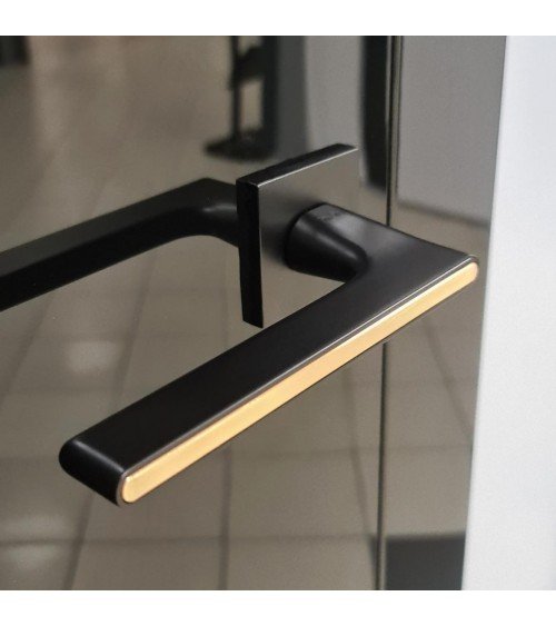 Black and Gold Two-Tone Door Handle on a square plate - Ferrara model - designer handle