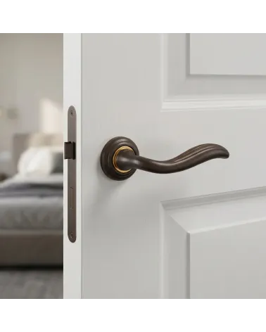 Mandelli Plisse round door handles in sculpted bronze finish