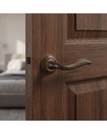 Mandelli Plisse round door handles in sculpted bronze finish