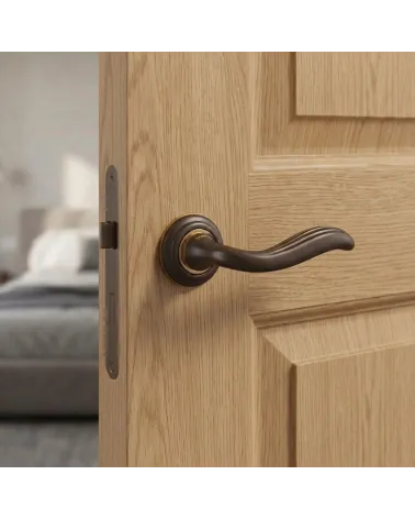 Mandelli Plisse round door handles in sculpted bronze finish