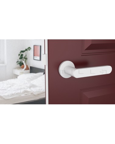 White ALORA door handle design handle bottom view mounted on a door