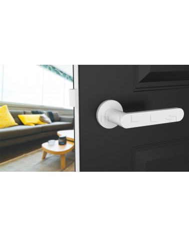 White ALORA door handle design handle front view mounted on an ajar door
