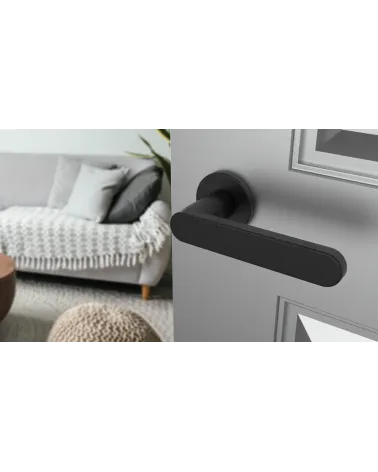 Black ALORA door handle designer handle angled view mounted on a door
