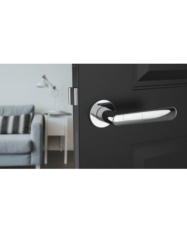 Polished chrome door handle ARIA designer handle front view mounted on a door