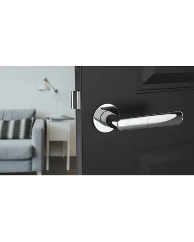 Polished chrome door handle ARIA designer handle front view mounted on a door