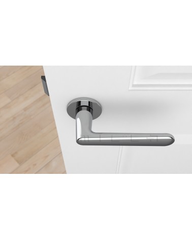 Polished chrome door handle ARIA designer handle top view mounted on a door