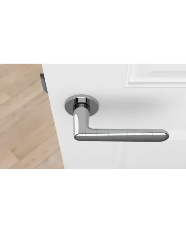 Polished chrome door handle ARIA designer handle top view mounted on a door