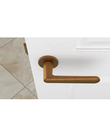 Copper ARIA design door handle top view mounted on a door