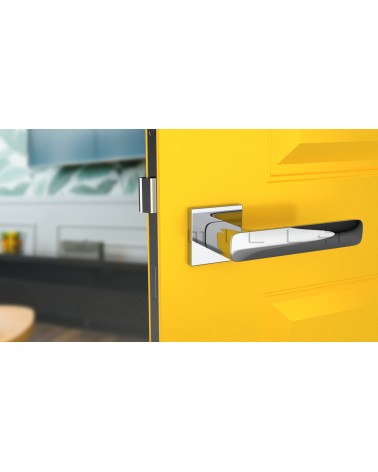 Polished chrome STELLA door handle design handle front view mounted on a door