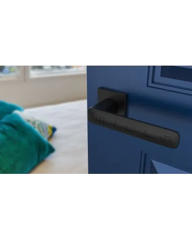 Classic STELLA door handle design hardware angled top view mounted on a door