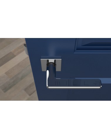 Polished chrome SETIA door handle design handle top view mounted on a door