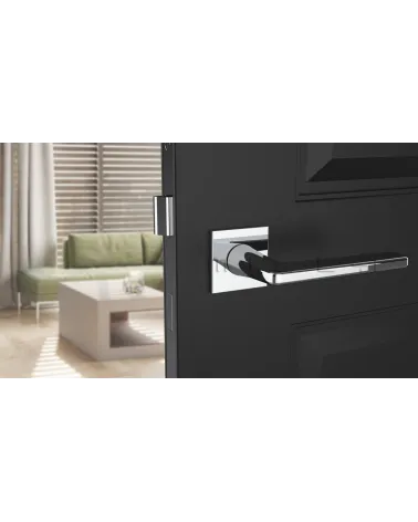 Contemporary SETIA designer door handle front view mounted on a door