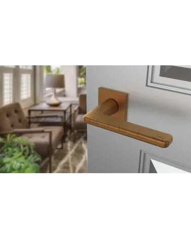 SETIA copper door handle design angled top view mounted on a door