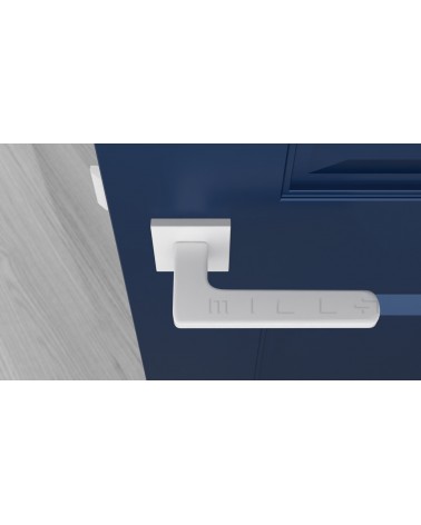 White YUKA door handle designer ironmongery top view mounted on a door