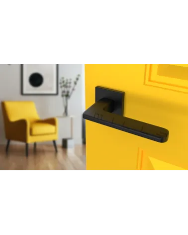 YUKA modern door handle designer handle angled top view mounted on a door