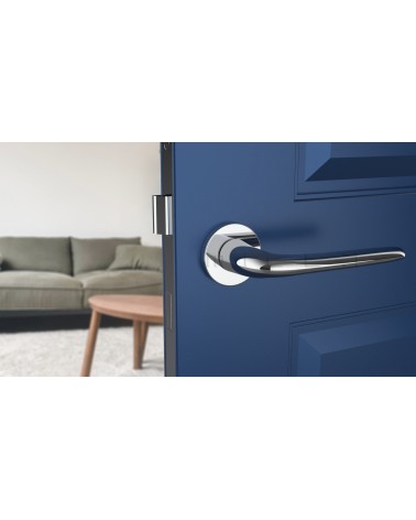 AZALIA polished chrome door handle designer handle mounted on an ajar door