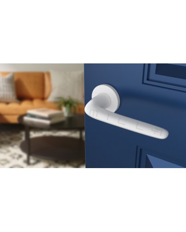 White AZALIA door handle design handle angled view mounted on a door
