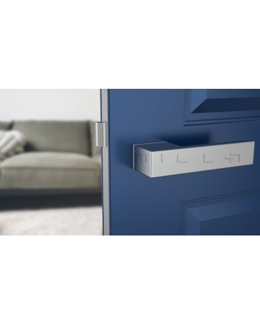 Satin chrome CARLINA designer door handle front view mounted on a door