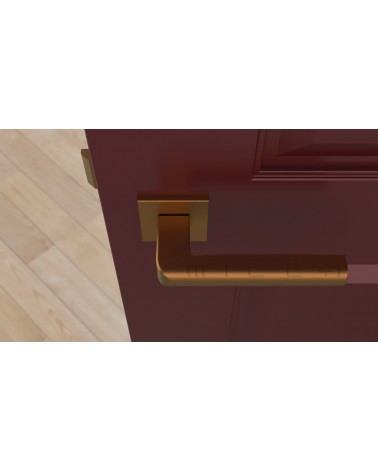 Copper SALICE door handle designer ironmongery top view mounted on a door
