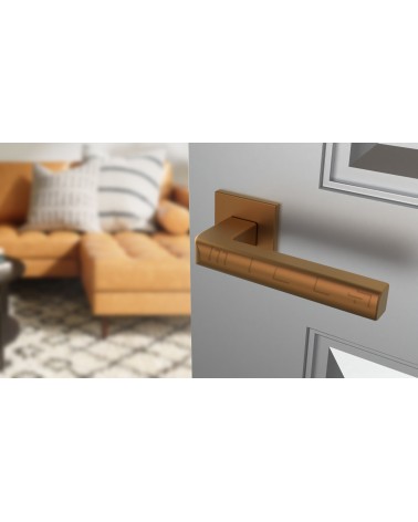 SALICE copper door handle design hardware angled view mounted on a door