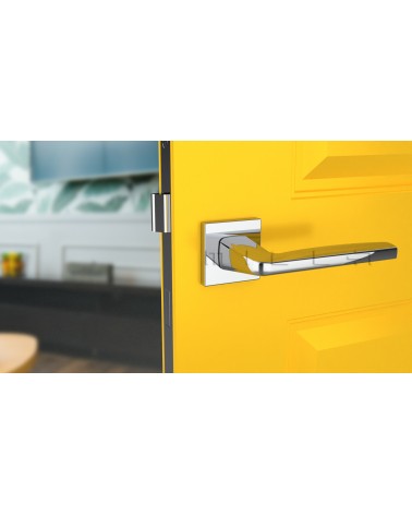 ERBA polished chrome door handle design handle front view mounted on a door
