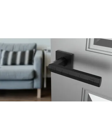 Black FRESIA door handle designer handle angled view mounted on a door