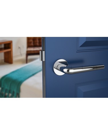 Polished chrome FUNKIA design door handle front view mounted on a door