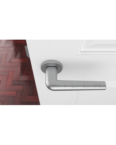 Satin chrome FUNKIA design door handle top view mounted on a door