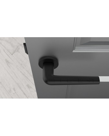 Black FUNKIA door handle design handle top view mounted on a door