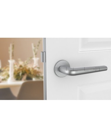 Satin chrome FUNKIA door handle design handle front view mounted on a door