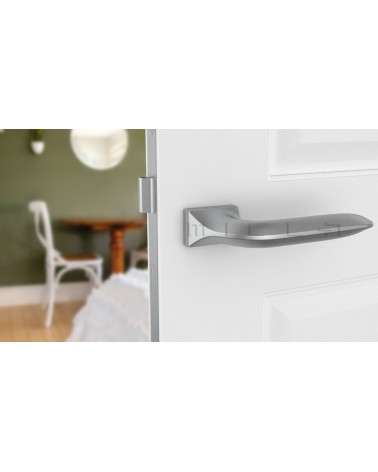 Satin chrome GLADIOLA door handle design handle front view mounted on a door
