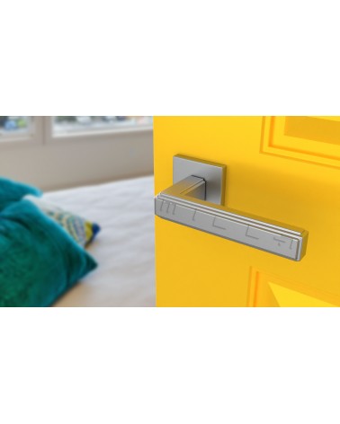 Satin chrome RAFLESIA door handle designer handle mounted on an ajar door