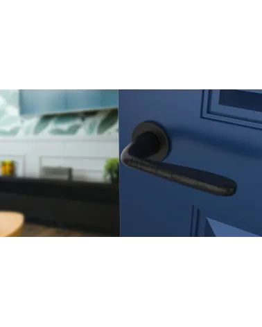 HIACYNTA contemporary door handle design handle angled top view mounted on a door