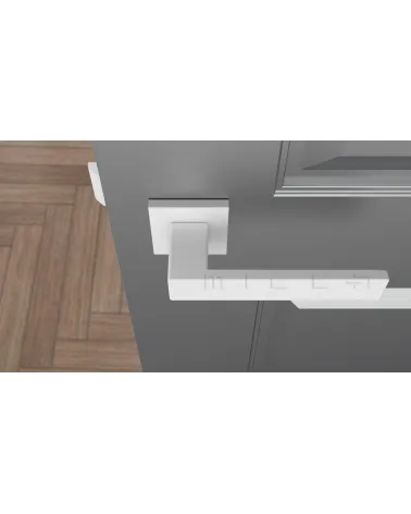 White PINA door handle design handle top view mounted on a door