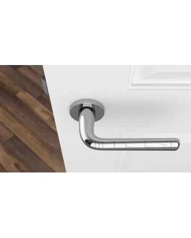 Polished chrome door handle TULIPA interior door design top view mounted on a door