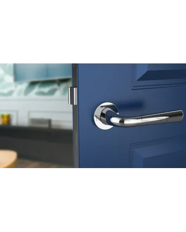 Polished chrome door handle TULIPA interior door design front view mounted on a door