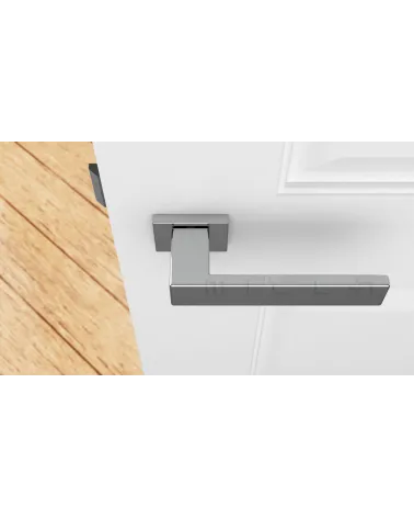 PINA polished chrome door handle design handle top view mounted on a door