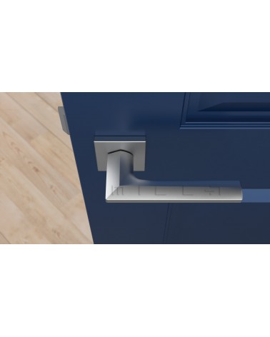 Satin chrome JASMINA door handle designer handle top view mounted on a door