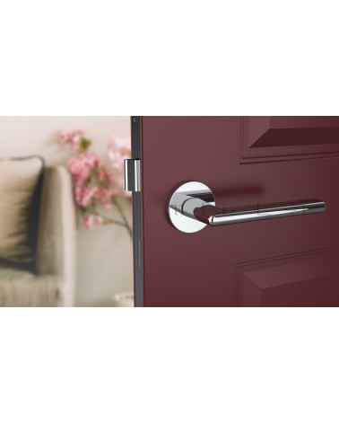 Polished chrome KALMIA door handle design handle front view mounted on a door