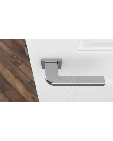 Polished chrome ISMENA door handle design ironmongery top view mounted on a door