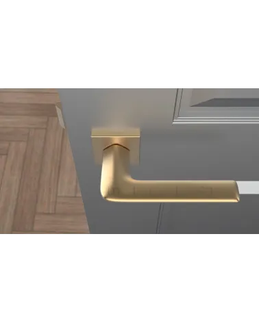 LILA matt gold design door handle top view mounted on a door