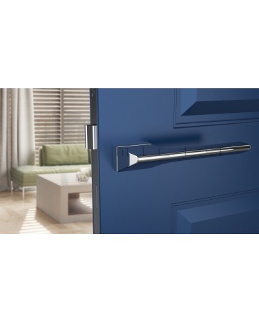 Polished chrome LUPINA door handle design handle front view mounted on a door