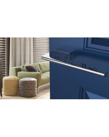 Polished chrome LUPINA door handle design handle angled view mounted on a door