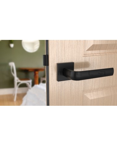 MELA black door handle designer handle front view mounted on a door