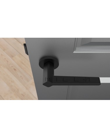 NINFEA black door handle designer ironmongery top view mounted on a door